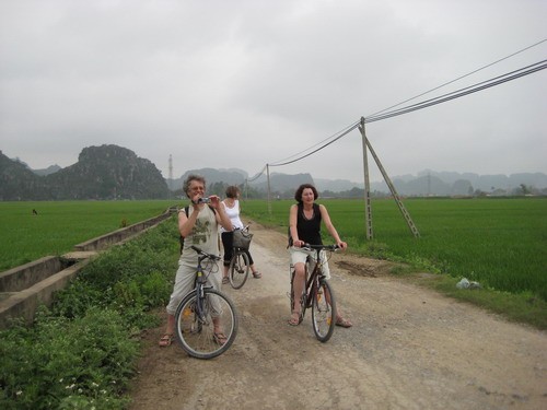 Tourist biking in Ninh Binh