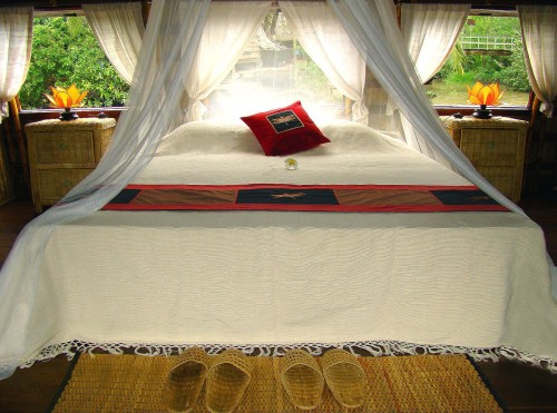 Bed room on the Song Xanh Sampan cruise