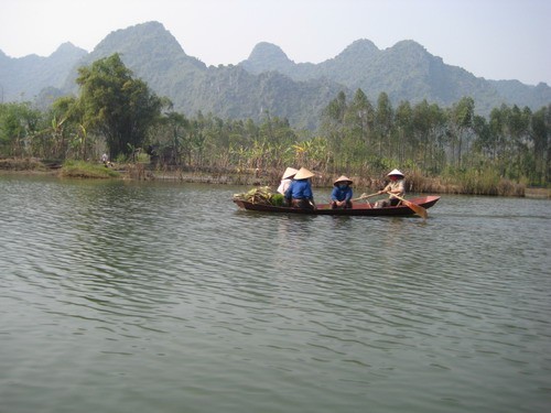 Vietnam Farmer in Huong river